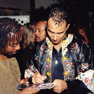 Vincent signing CD's at the Release Party. To the right the international award winning writer Edwin Morris.