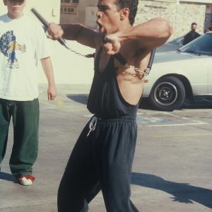 Stan Derain as MC Kung Fu using the double nunchakus in the feature film City Dragon