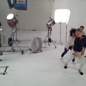 Artistic Director/Choreographer directing dancers on the Set of a GAP commercial