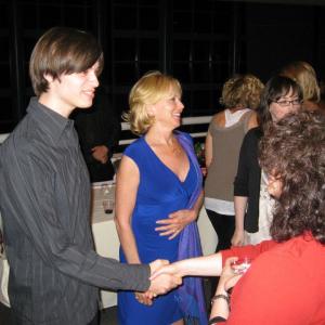 Nathan Norton Linda Purl greeting people backstage at the play A Happy End