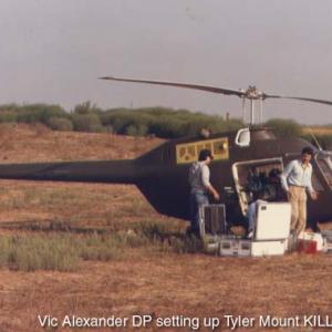 Vic Alexander DP setting up Tyler Mount on helicopter during the filmming of KILLZONE 1985