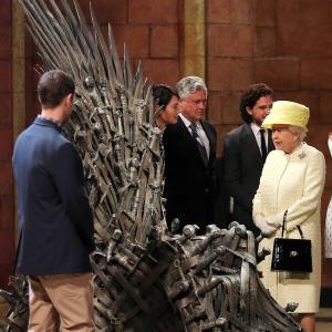 Queen Elizabeth II meets cast members of the HBO TV series 'Game of Thrones' Lena Headey and Conleth Hill as she views some of the props including the Iron Throne on set in Belfast's Titanic Quarter on June 24, 2014 in Belfast, Northern Ireland. The Royal party are visiting Northern Ireland for three days.