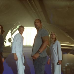 Still of Carla Gugino, Dwayne Johnson, AnnaSophia Robb and Alexander Ludwig in Race to Witch Mountain (2009)