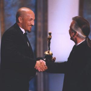 David LeRoy Anderson and Rick Baker shake hands