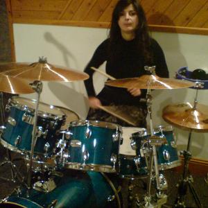 Francesca drumming in her studio.