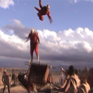 Sean pictured top and another stuntman pictured bottom flying from Chariot air ram on Oliver Stones Alexander