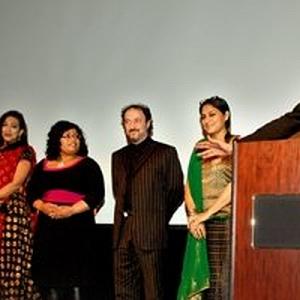 The headlining cast directorand publicist for Piyalir Password at movie premiere
