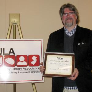 Steven Jon Whritner accepting an award from the NJ Library Association (June 5, 2012).