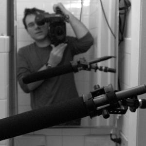 Director Carlos Ferrer captures himself through a mirror while shooting a scene from Retina.