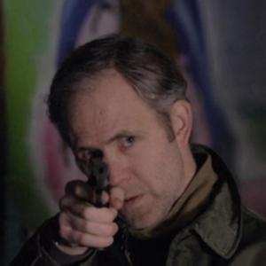 'Mike' demonstrating the use of a 9mm Browning HP Pistol in the short film Forgivness.