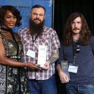 Toby Halbrooks and James M. Johnston accept the Piaget Producers Award from Angela Bassett at the 2014 Film Independent Filmmaker Grant And Spirit Awards Nominees Brunch at BOA Steakhouse on January 11, 2014 in West Hollywood, California.