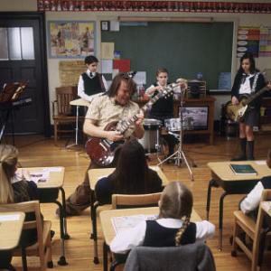 (Center) Jack Black as Dewey, (kids back row, left to right) Robert Tsai as Lawrence, Joey Gaydos Jr. as Zack, Kevin Clark as Freddy and Rebecca Brown as Katie