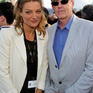 Director Lucy Walker and TIFF Director Piers Handling attend the TIFF Party held at the Plage des Palms during the 63rd Annual International Cannes Film Festival on May 14 2010 in Cannes France