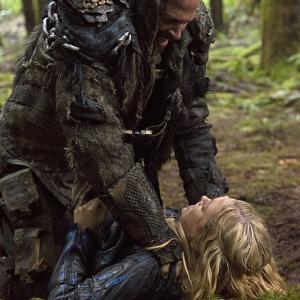Still of Eliza Taylor and Graham Shiels in The 100 2014