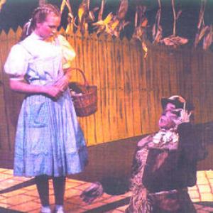 Gregory as Scarecrow in WIZARD OF OZ on stage with Kelsey Allan 2003