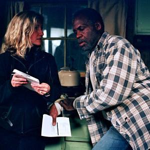 Director Gabrielle Savage Dockterman discusses a scene with Danny Glover on the set of WOODCUTTER