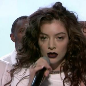 Still of Trevor Snarr and Lorde in her performance of Yellow Flicker Beat on the 2014 American Music Awards