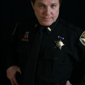 Dennis as a cop