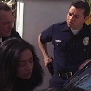 Still of Eddie Diaz with Aimee Garcia and Patrick Robert Smith in Standoff