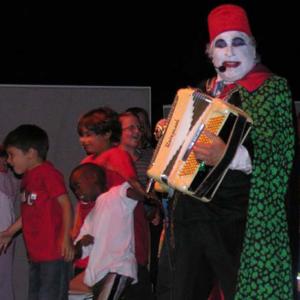 Count Smokula performs on stage with kids on base, in Guantanamo Bay, Cuba