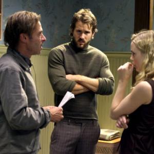 Director ANDREW DOUGLAS discusses a scene with RYAN REYNOLDS and MELISSA GEORGE on the set of THE AMITYVILLE HORROR
