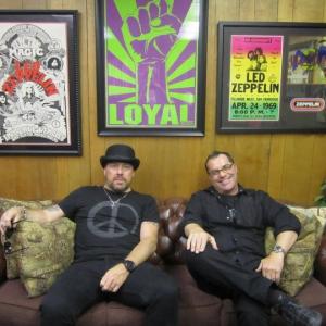 Jason Bonham and Bob Bekian hanging out in Bobs office with original Led Zeppelin posters in the background