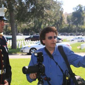 Producer Randy Bellous and a member of the USMC, volunteering as a photographer for the Memorial Day Event at the Los Angeles National Cemetery.