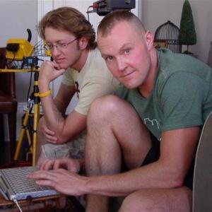 Vidkid Timo (left) watching as Jeffery Roberson (right) edits footage they filmed for a Varla Jean Merman musical video.