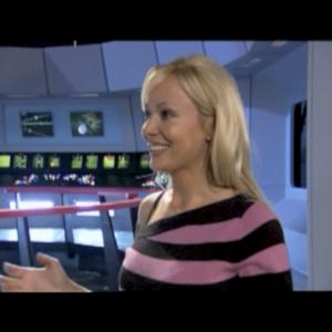 Screen Grab of Host Stacey Hayes from STAR TREK THE TOUR DVD