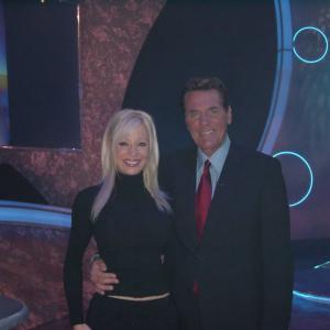 Co Hosts of the Game Show Network Show Lingo Chuck Woolery and Stacey Hayes pose on set