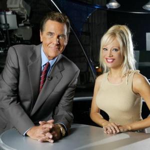 Co Hosts of the Game Show Network Show Lingo Chuck Woloery and Stacey Hayes pose on set