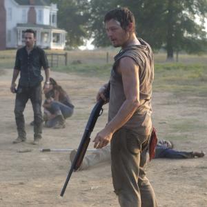 Still of Norman Reedus Jeffrey DeMunn Andrew Lincoln Melissa McBride Sarah Wayne Callies Chandler Riggs and Jane McNeill in Vaiksciojantys negyveliai 2010