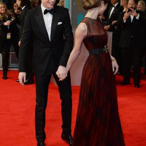 Eddie Redmayne L and Hannah Bagshawe attend the EE British Academy Film Awards 2014 at The Royal Opera House on February 16 2014 in London England