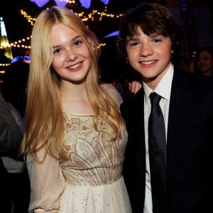Elle Fanning and Joel Courtney pose at the after party for the premiere of Paramount Pictures Super 8 at the Village Theater on June 8 2011 in Los Angeles California