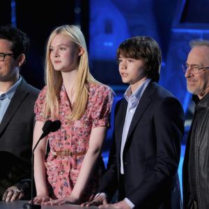 JJ Abrams Elle Fanning Joel Courtney and Steven Spielberg speak onstage during the 2011 MTV Movie Awards at Universal Studios Gibson Amphitheatre on June 5 2011 in Universal City California