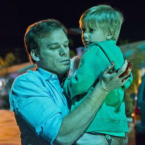 Still of Michael C. Hall and Jadon Wells in Deksteris (2006)