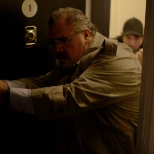 Detective Hendry breaking down the door in LOTUS