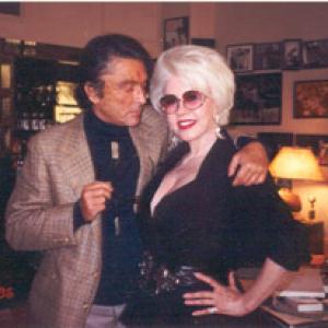 ROBERT EVANS & JEANE CARMEN in his office at PARAMOUNT STUDIOS. Note: JEANNE CARMEN was a TOP MODEL for ROBERT EVANS clothing line EVAN-PICONE in New York in the 1950's
