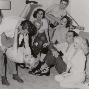 JEANNE CARMEN [dark hair, back row] & Rockabilly Legend & Rock N Roll Hall of Famer EDDIE COCHRAN [back row with guitar in hand] party after hours on the set of UNTAMED YOUTH