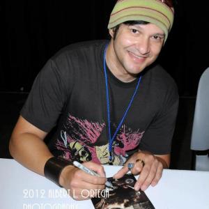 Neil DMonte signing TBK The Toolbox Murders 2 movie paraphernalia at Stan Lees Comikaze 2011