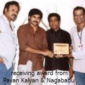receiving award from Pavan Kalyan & Nagababu