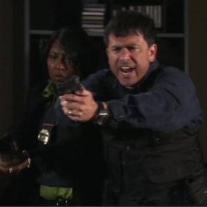 John Prudhont as FDLE Agent Ed Royal & Patricia Simmons as Det. Cooper in Season 5, Episode 8 of 