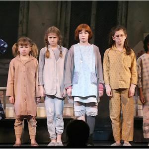 Kathie Lee Gifford left as Miss Hannigan Madison Zavitz 2nd orphan from left as Pepper and other orphans in a scene from ANNIE at the Theater at Madison Square Garden NYC during the 2006 holidayseason