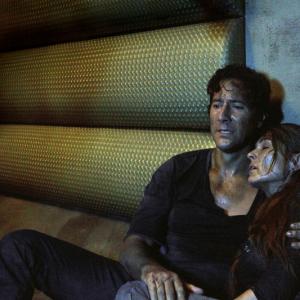 Still of Henry Ian Cusick and Paige Turco in The 100 2014