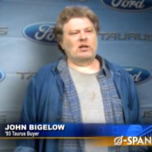 Joe Hansard as John Bigelow in The Onion webisode entitled Ford Unveils New Car For Cash-Strapped Buyers: The 1993 Taurus. November 5, 2009.