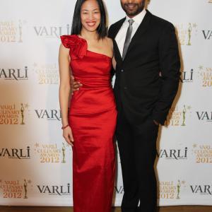 November 15 2012 Actor Manu Narayan cohost of the First Annual Varli Culinary Awards with actorphotographer Lia Chang on the red carpet at The Altman Building in New York City