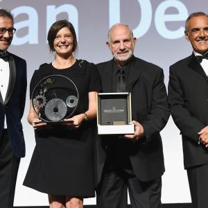 Chiara Mastroianni and Brian De Palma on stage with their awards with Laurent Vinay and Venice Film Festival director Alberto Barbera at the JaegerLeCoultre Glory to the Filmmaker 2015 Award Ceremony
