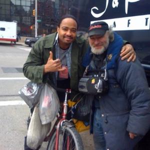 Actors Dennis Jay Funny and Radioman w his bicycle outside Jacob Javitts Convention Center in Manhattan NYC