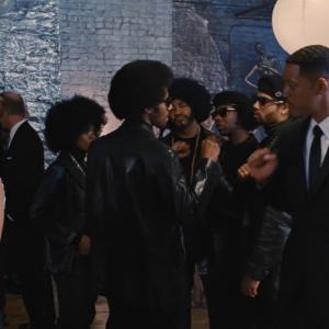 Huey Newton Dennis Jay Funny and the Black Panthers give Agent J a pound at Andy Warhols party back in time 1969 Men In Black 3 IMAX film
