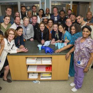 Behind The Scenes : Nurse Jackie played by Edie Falco with her core hospital staff at All Saints (Dennis Jay Funny, center with halo) on set during the 7th and final season shooting at Kaufmann Astoria Studios, Queens NY.